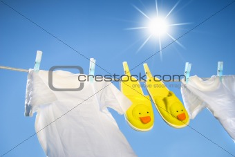 White t-shirts and slippers on the clothesline