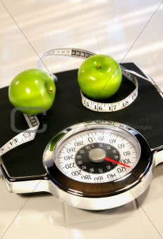 Weight scale with green apples