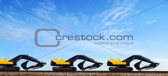 Power-shovels on rails. 