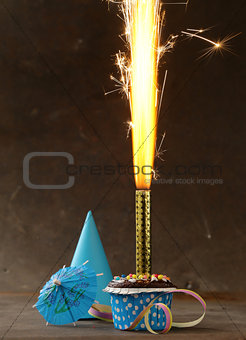 festive birthday dessert cake with lighted fireworks