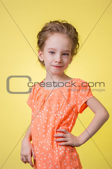 happy teen girl half length portrait isolated on yellow background