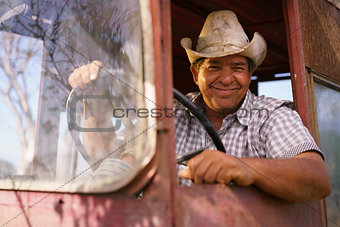 Portrait Happy Man Farmer Driving Tractor Looking At Camera