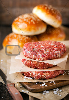 Raw ground beef meat steak cutlets and burger buns 