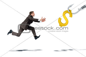 Businessman trying to catch dollar sign