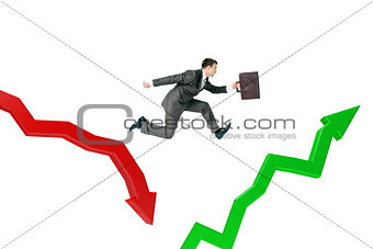 Businessman running in arrows