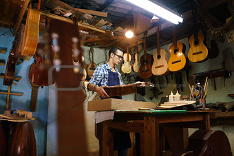 Artisan Lute Maker Storing Guitar Music Instrument In Case For C