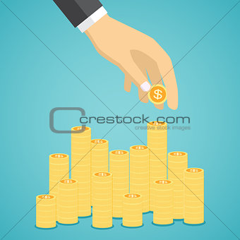 Hand put coin to stacks of golden coins