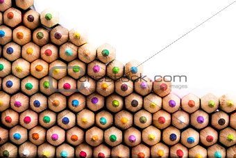 Macro shot of front facing color pencils pile