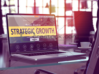 Strategic Growth on Laptop in Modern Workplace Background.