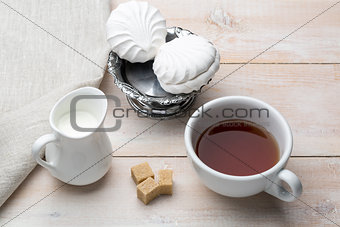 Set of cup black tea and dessert