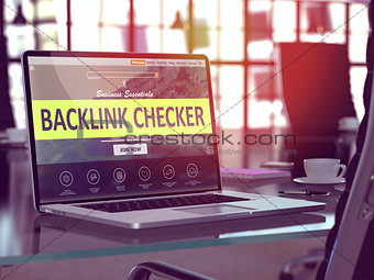 Backlink Checker on Laptop in Modern Workplace Background.