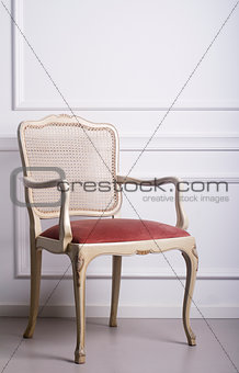 Vintage chair against white wall