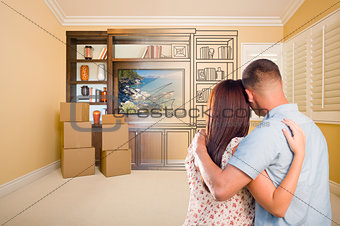 Young Couple Looking At Drawing of Entertainment Unit In Room