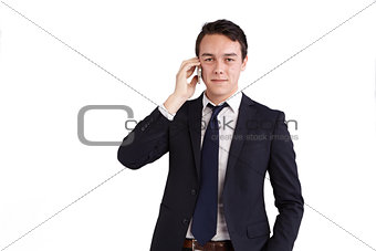 Happy young Caucasian business man holding a mobile phone
