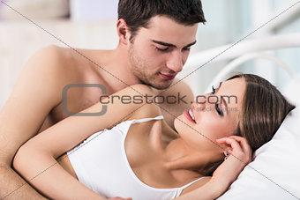 Loving couple in bed.