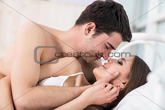 Loving couple in bed.
