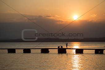 fisherman on sunset at sea