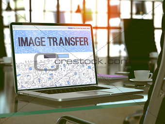 Image Transfer on Laptop in Modern Workplace Background.