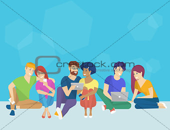Group of creative people using smartphone, laptop and tablet pc sitting on the floor