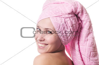The girl in a towel smiles
