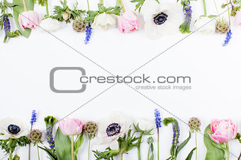Spring flowers, tulips, anemones, cloves and buttercups in two r