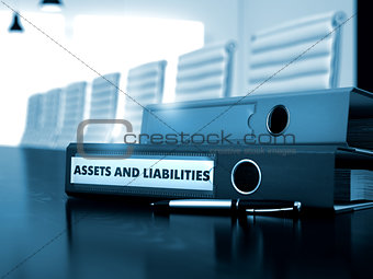 Assets And Liabilities on Office Binder. Blurred Image.