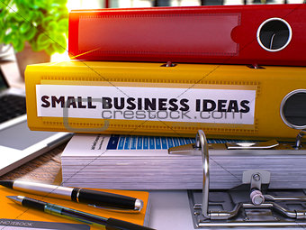 Small Business Ideas on Yellow Office Folder. Toned Image.
