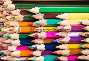 Color pencils pile arrangement closeup