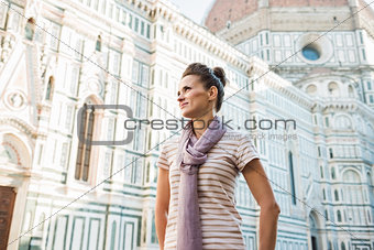 Young woman tourist standing near Duomo in Florence, Italy