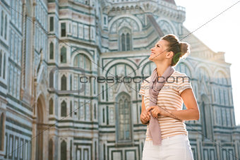 Happy woman tourist sightseeing in Florence, Italy