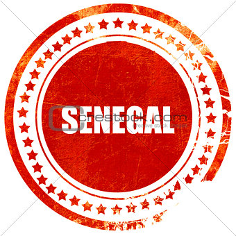 Greetings from senegal, grunge red rubber stamp on a solid white