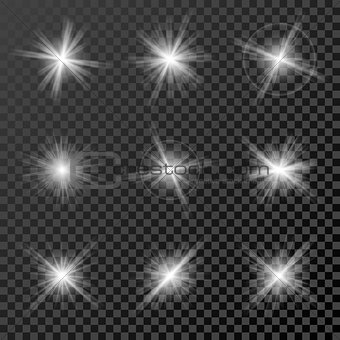 Set of glowing lights, stars and sparkles isolated on black  transparent background