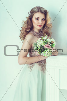 Beautiful bride in wedding dress. Portrait of young bride. Studio shot.