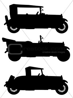 Black silhouettes of vintage cars