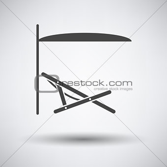 Sea beach recliner with umbrella icon