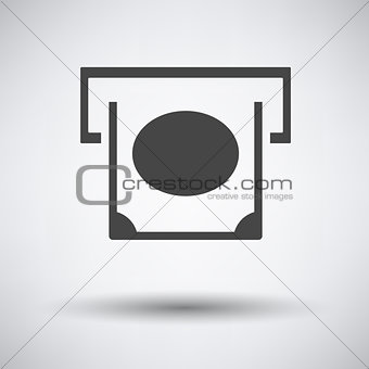 Banknote sliding from atm slot icon