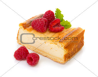 Cheesecake with fresh raspberries  isolated .