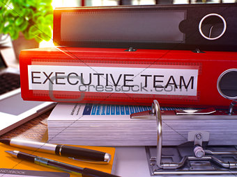 Executive Team on Red Office Folder. Toned Image.