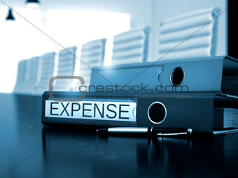 Expense on Binder. Blurred Image.
