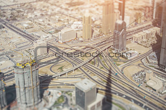 Highway road intersection in Dubai, sunny day, tilt-shift shooting