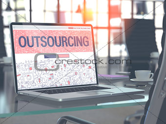 Outsourcing Concept on Laptop Screen.