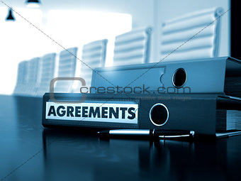 Agreements on Binder. Toned Image.