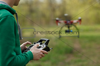 Man controling a drone.