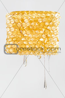 Honey dripping from honeycomb