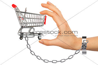 Chained hand holding shopping cart