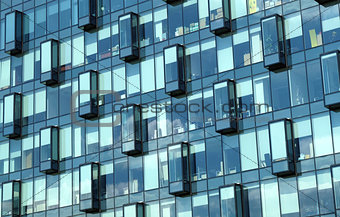 Facade of modern office building glass wall front view