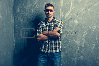 man posing with his arms folded