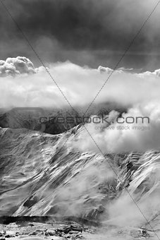 Black and white view on ski resort in mist
