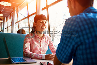 young man and woman with laptop