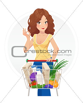 Shopping. Beautiful girl with shopping cart.